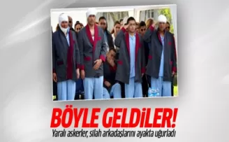 Yaralı askerler, silah arkadaşlarını ayakta uğurladı